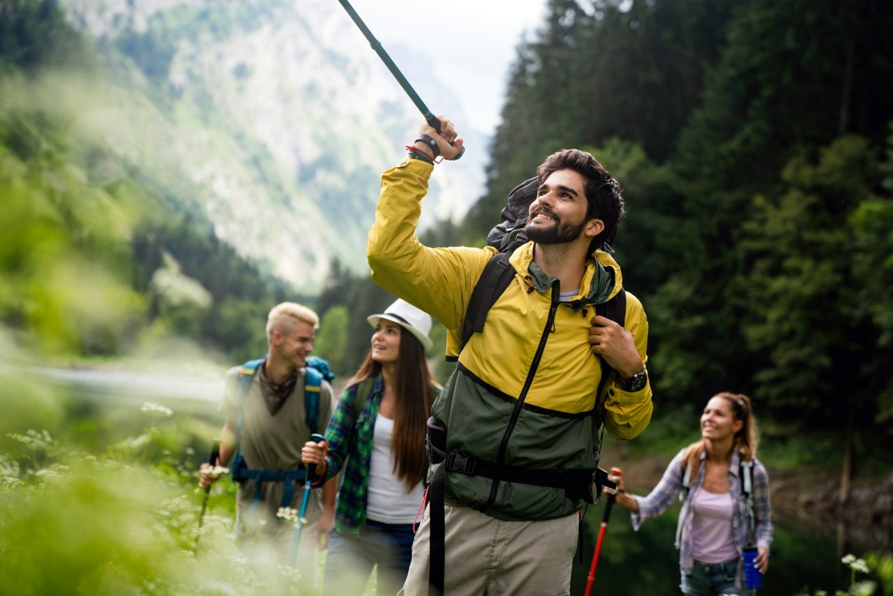 group-of-happy-fit-friends-hiking-trekking-together-outdoor-nature.jpg